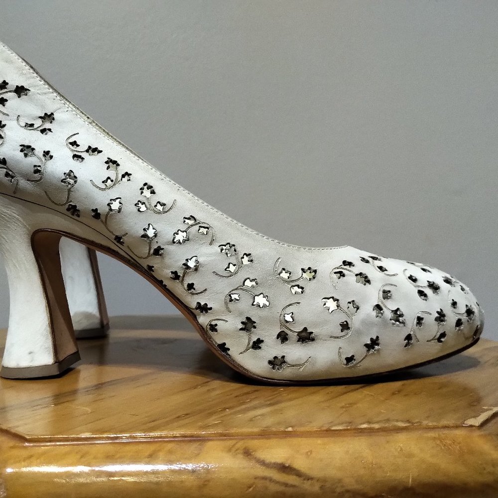 Laser-cut white leather heels